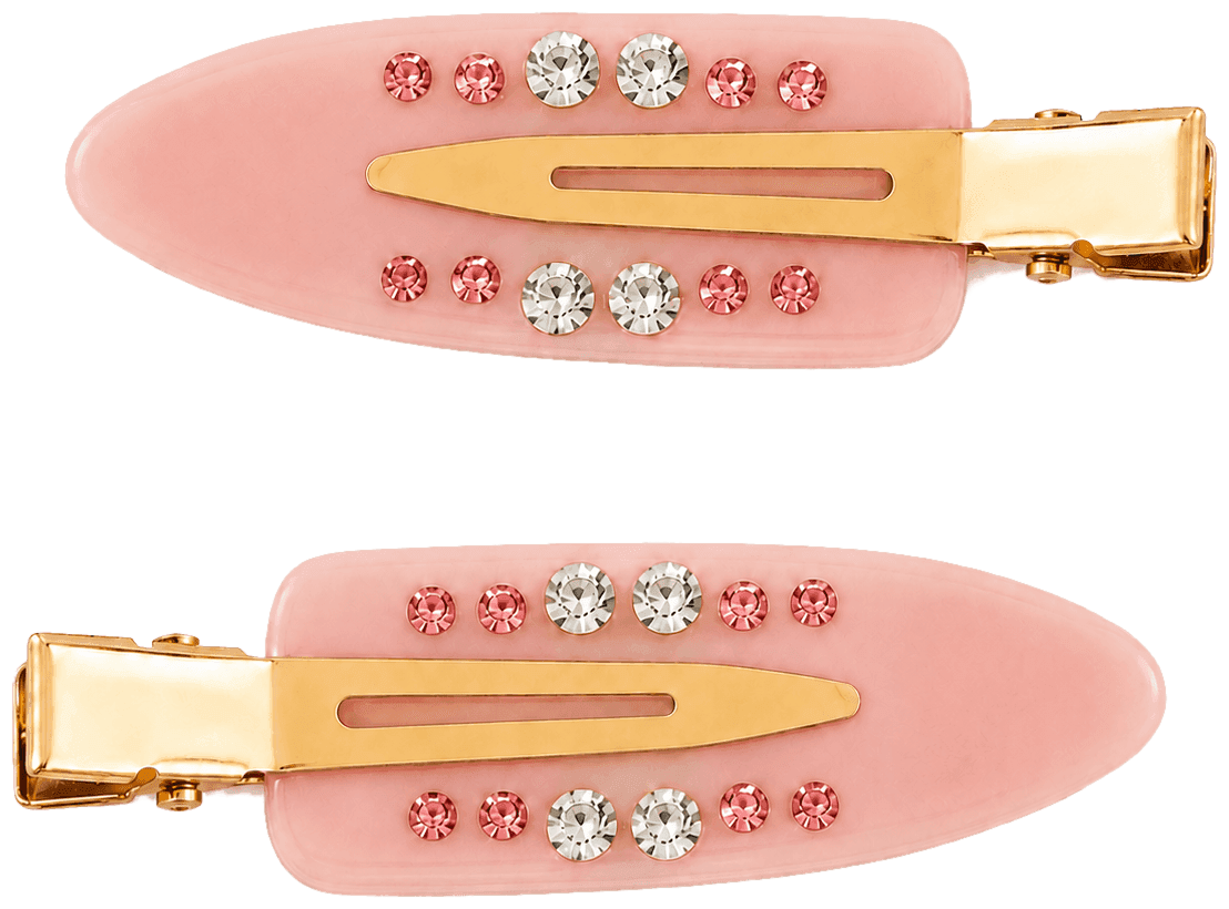 A pair of soft pink Blush Confetti pintail clips with gold hardware and rows of pink and clear stones.